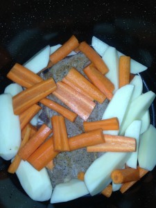 Roast, potatos, and carrots in the pot