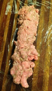 I plopped the meat down in a haphazard tube shape to start with on my saran wrap.