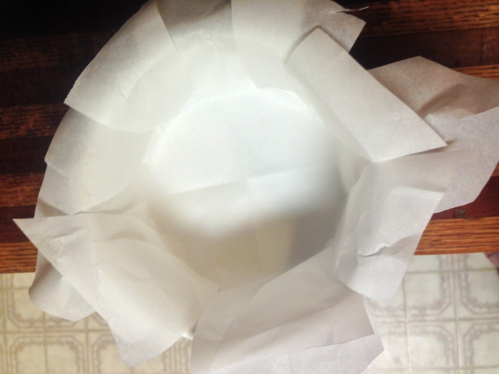 I folded the paper in half twice, then cut small strips from the outside edge to approximately the edge of the inside of the bowl. When unfolded, it lined the bowl perfectly!
